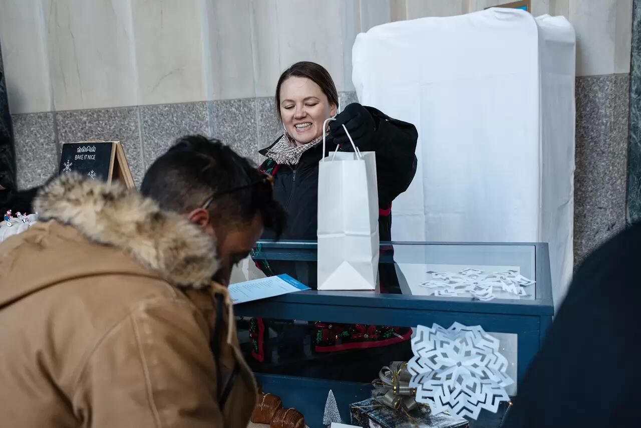 Pastry Chef Laura Cronin handing out Madison Squares