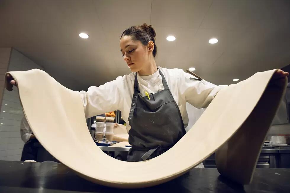 Chef Orianna holding laminated dough
